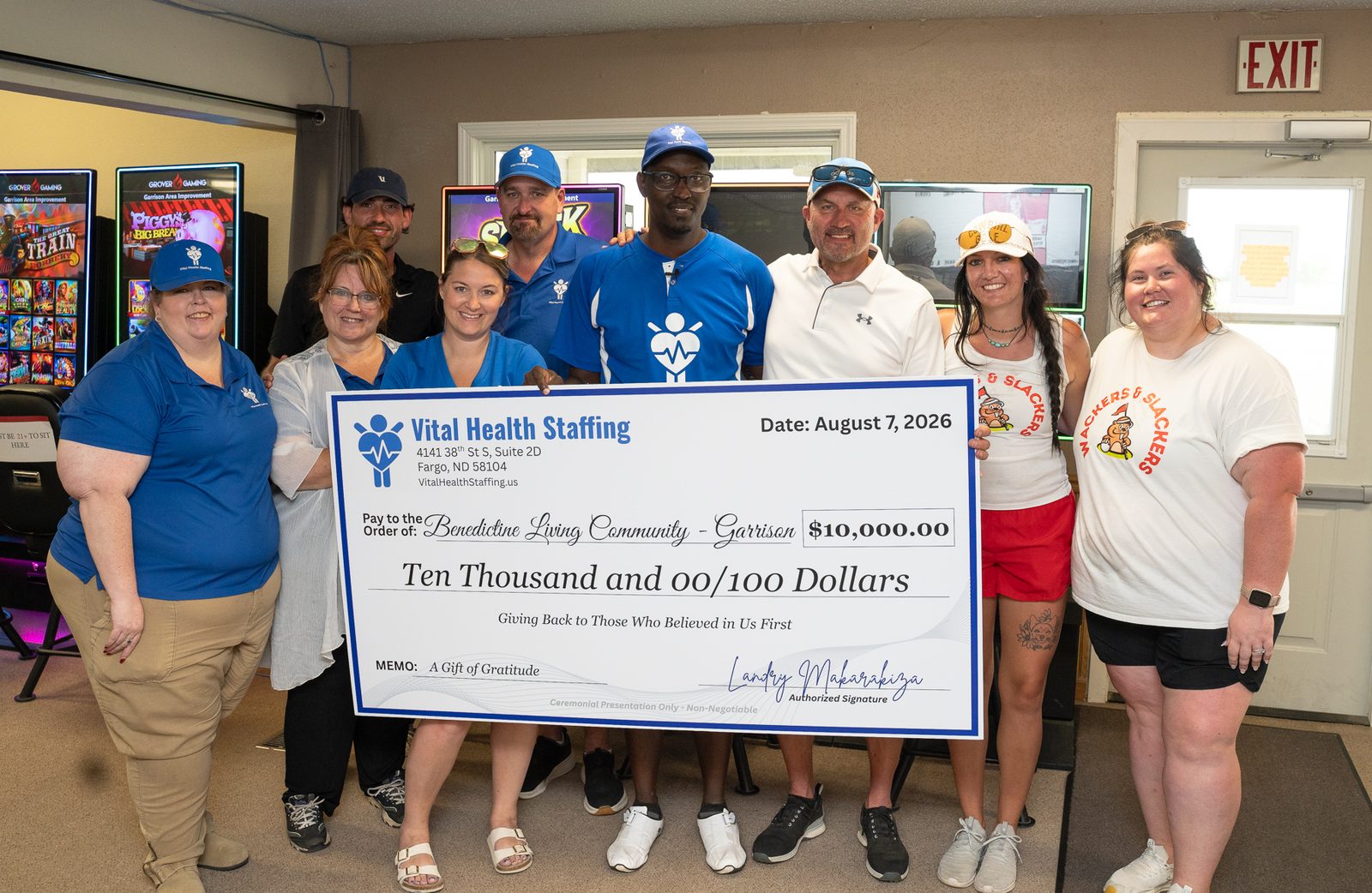Vital Health Staffing team presenting a $10,000 check to Benedictine Living Community – Garrison